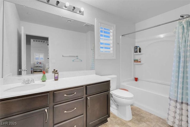 full bathroom featuring toilet, plenty of natural light, vanity, and shower / bath combo with shower curtain