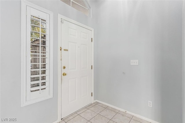 doorway with light tile patterned flooring