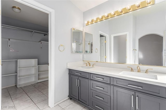 bathroom with tile patterned floors and vanity