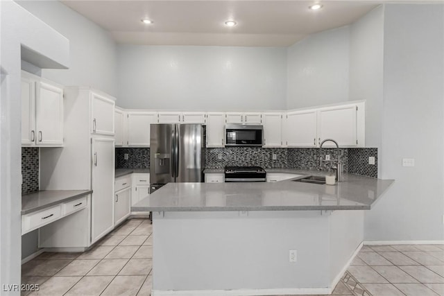 kitchen with white cabinetry, sink, light tile patterned floors, kitchen peninsula, and stainless steel appliances