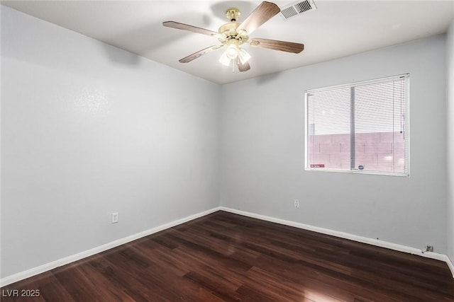 unfurnished room with dark hardwood / wood-style floors and ceiling fan