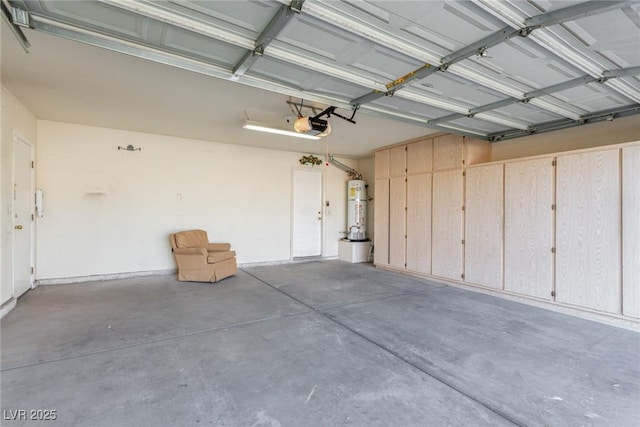 garage with a garage door opener and water heater