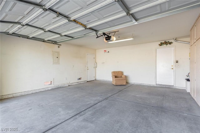 garage featuring a garage door opener and electric panel