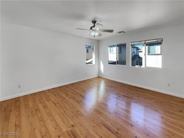 spare room with ceiling fan and light hardwood / wood-style floors