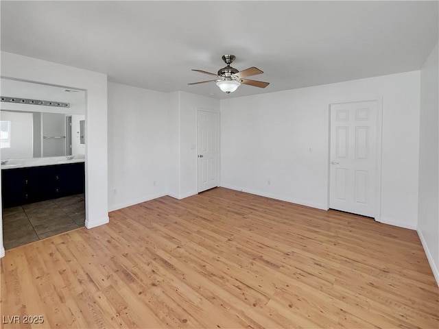 unfurnished bedroom with ceiling fan and wood-type flooring