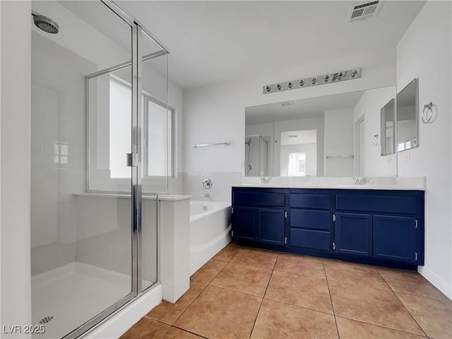 bathroom with vanity, tile patterned flooring, and independent shower and bath