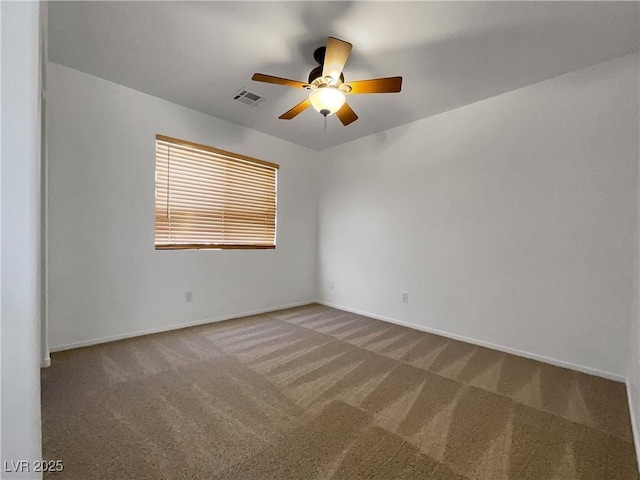 spare room with ceiling fan and carpet floors