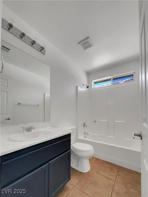 full bathroom with toilet, vanity, tile patterned flooring, and shower / tub combination