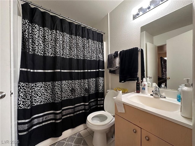 bathroom featuring tile patterned flooring, vanity, curtained shower, and toilet