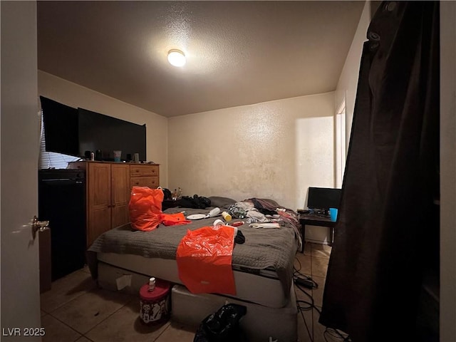 bedroom featuring light tile patterned floors