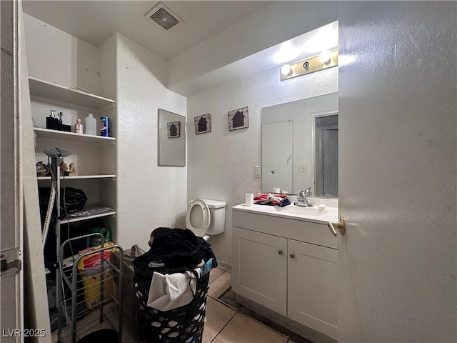 bathroom featuring tile patterned floors and vanity