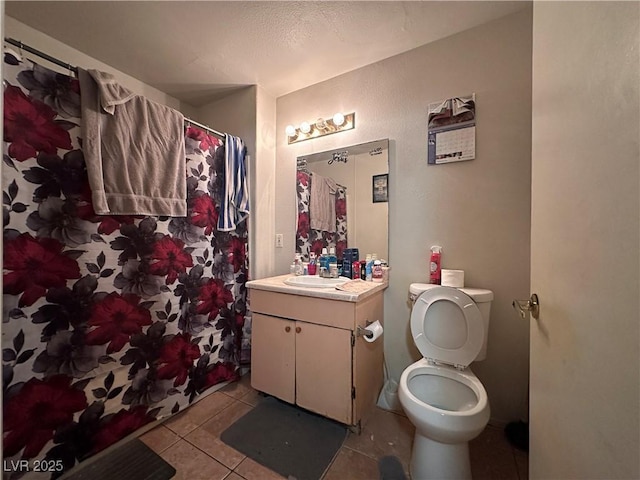 bathroom featuring tile patterned flooring, vanity, toilet, and a shower with shower curtain