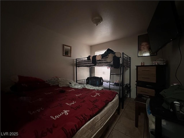 bedroom featuring light tile patterned floors