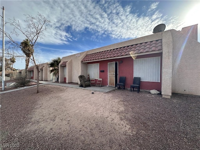 back of house with a patio area