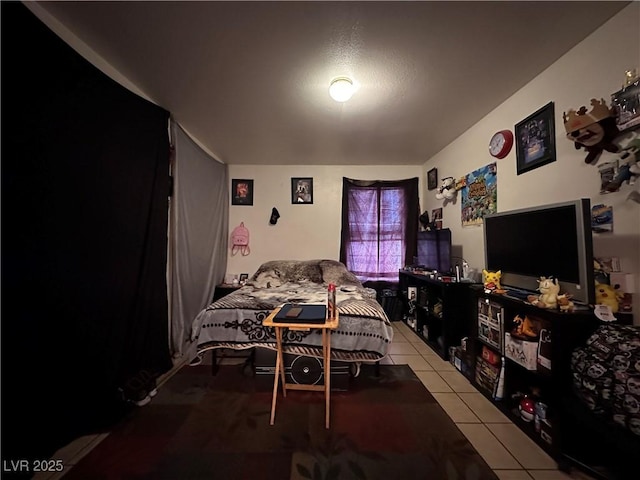 bedroom with light tile patterned floors