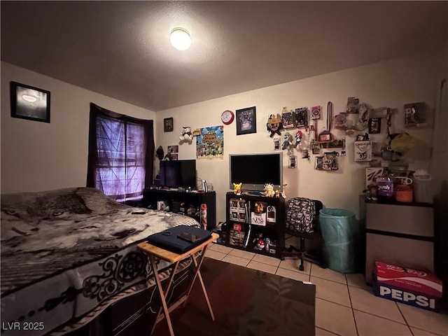 bedroom with light tile patterned floors