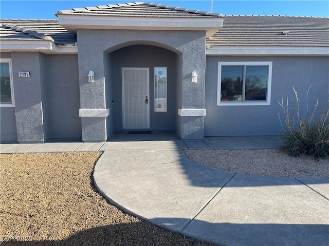 property entrance with a patio area