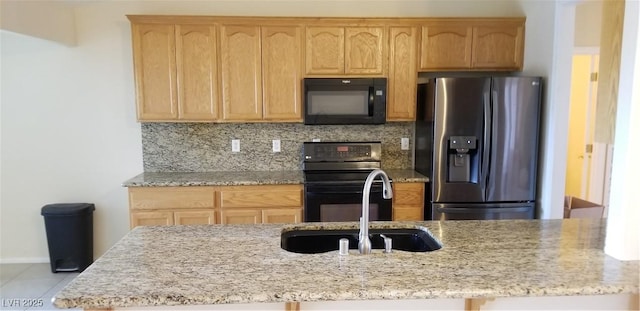 kitchen featuring sink, range with electric cooktop, tasteful backsplash, light stone counters, and stainless steel fridge with ice dispenser