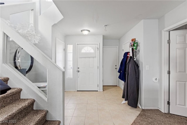 foyer entrance featuring light tile patterned flooring