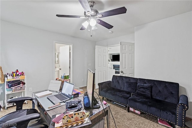 carpeted office space with ceiling fan