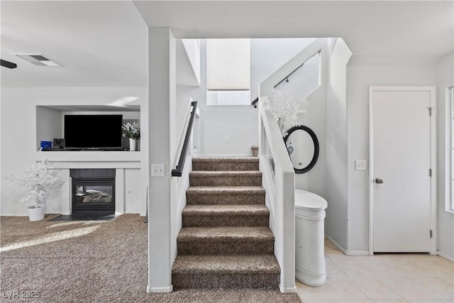 staircase with tile patterned flooring