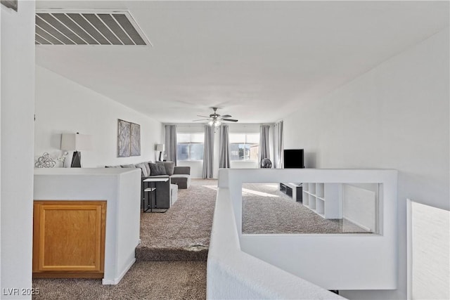 carpeted living room featuring ceiling fan