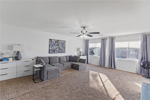 carpeted living room with ceiling fan