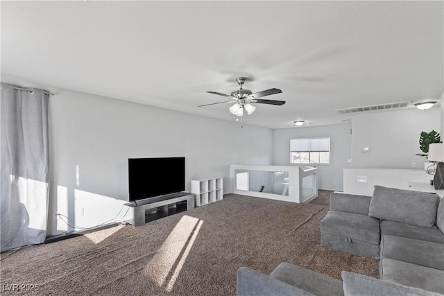 unfurnished living room with carpet floors and ceiling fan