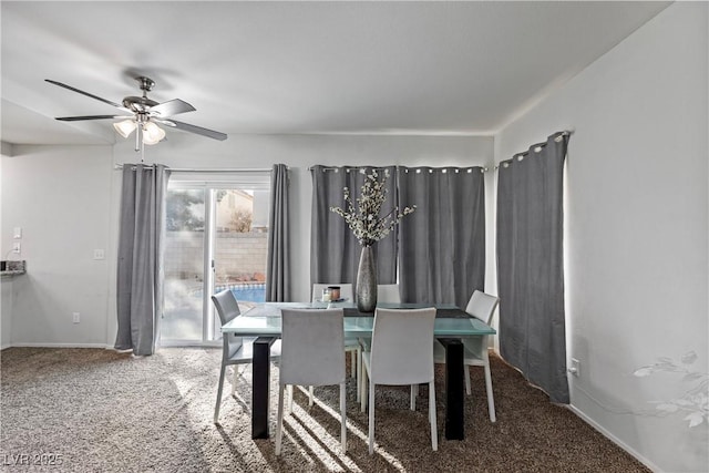 dining area featuring carpet flooring and ceiling fan