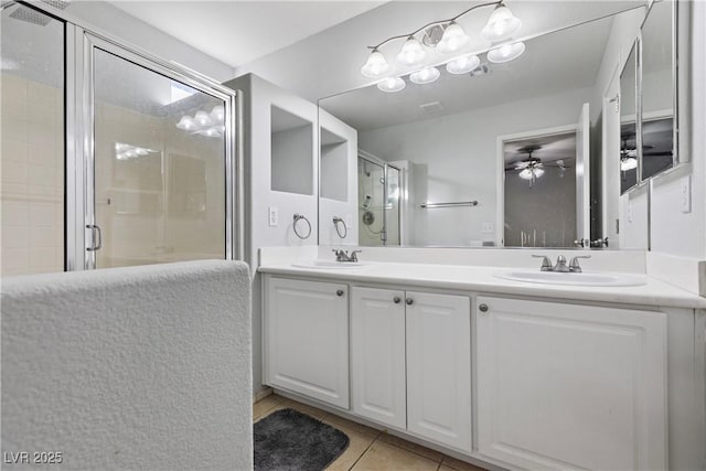 bathroom featuring tile patterned flooring, vanity, an enclosed shower, and ceiling fan