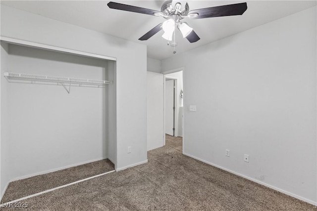 unfurnished bedroom featuring ceiling fan, a closet, and carpet