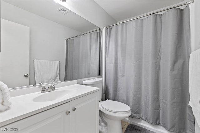 full bathroom with vanity, shower / tub combo with curtain, and toilet