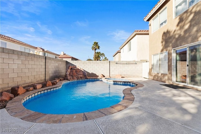 view of swimming pool featuring an in ground hot tub and a patio