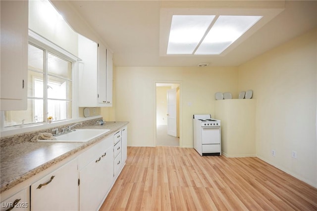 kitchen with white cabinetry, white electric stove, sink, and light hardwood / wood-style flooring