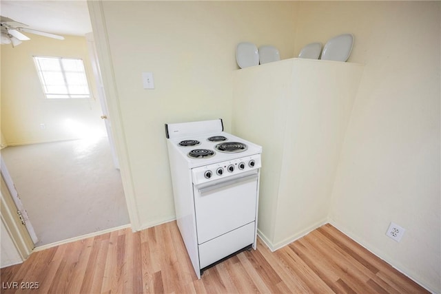 kitchen with electric stove, light hardwood / wood-style flooring, and ceiling fan