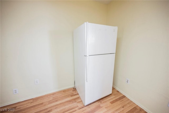 spare room with light wood-type flooring