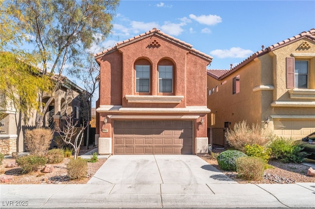 mediterranean / spanish-style home featuring a garage