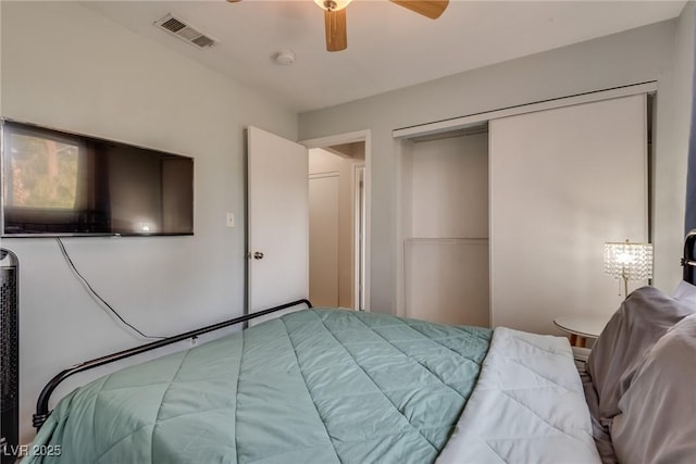 bedroom featuring ceiling fan and a closet