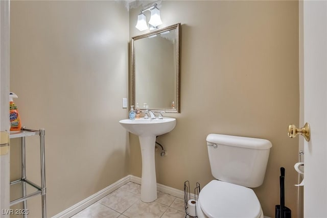 bathroom featuring tile patterned flooring and toilet