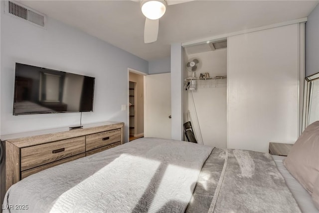 bedroom featuring ceiling fan and a closet