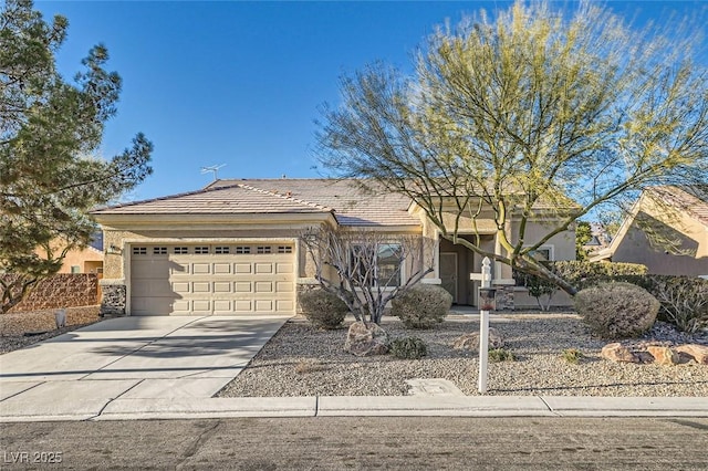 single story home featuring a garage, driveway, a tile roof, and stucco siding