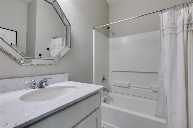 bathroom with vanity and shower / tub combo