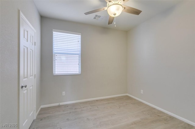 unfurnished room featuring ceiling fan and light wood-type flooring