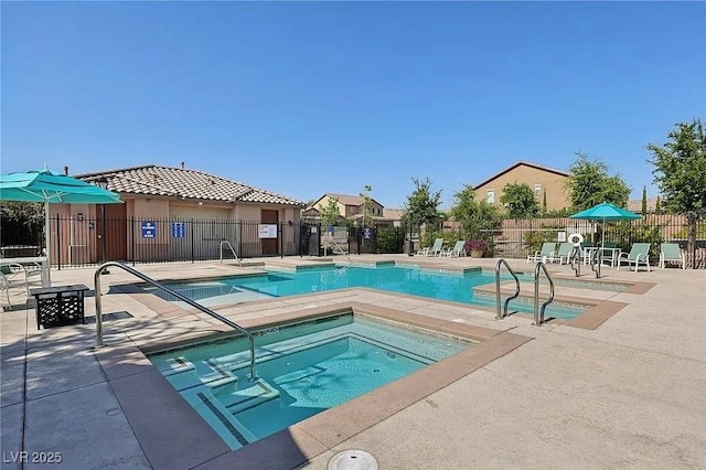 view of swimming pool with a community hot tub and a patio