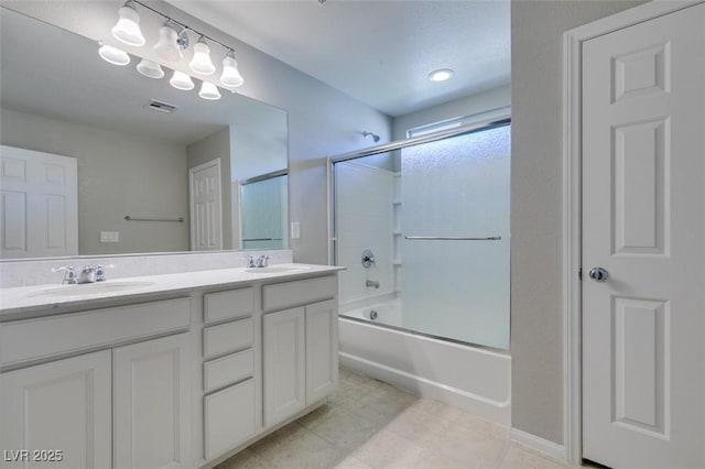 bathroom with enclosed tub / shower combo and vanity