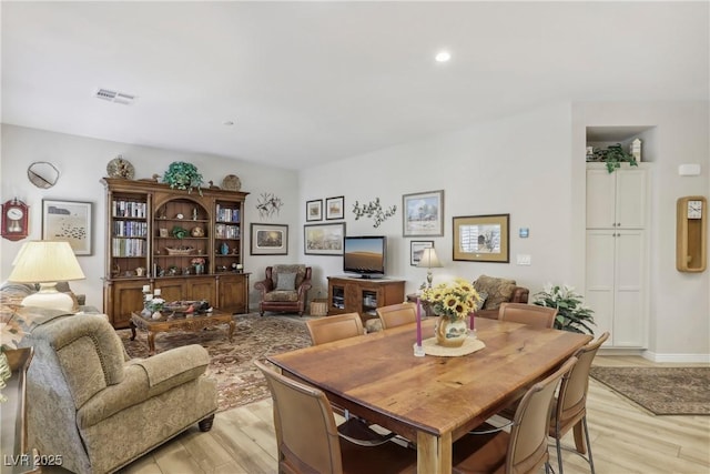 dining room with recessed lighting, visible vents, and light wood-style flooring