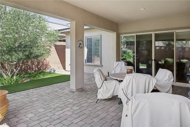 view of patio / terrace featuring fence