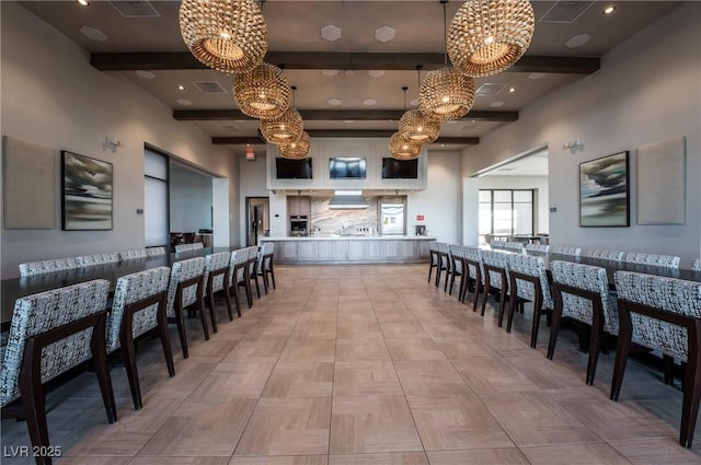 dining area featuring beamed ceiling, recessed lighting, and an inviting chandelier