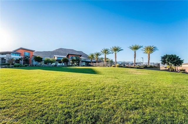 view of community with a lawn and a mountain view