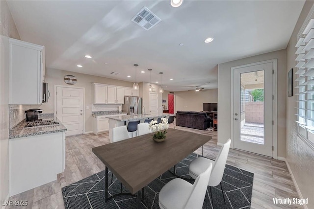 dining room with light wood-type flooring